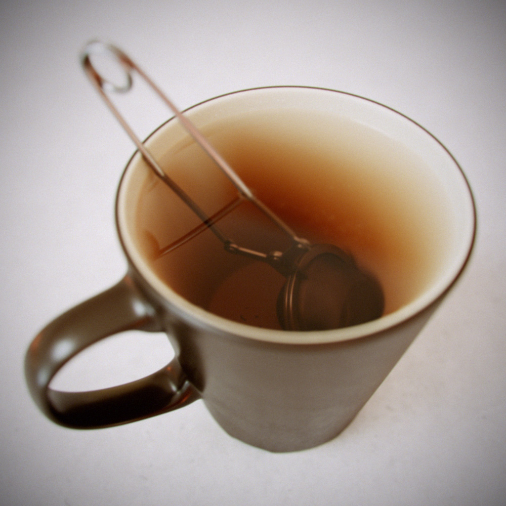 Tea cup with tea strainer.